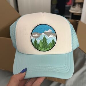 Blue and White Trucker Hat with Mountain Patch